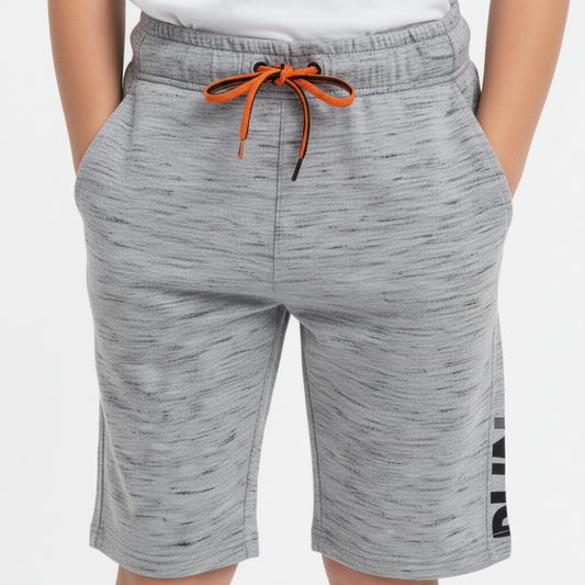 A pair of gray cotton shorts for boys with a drawstring waist and a small orange tag on the left leg.